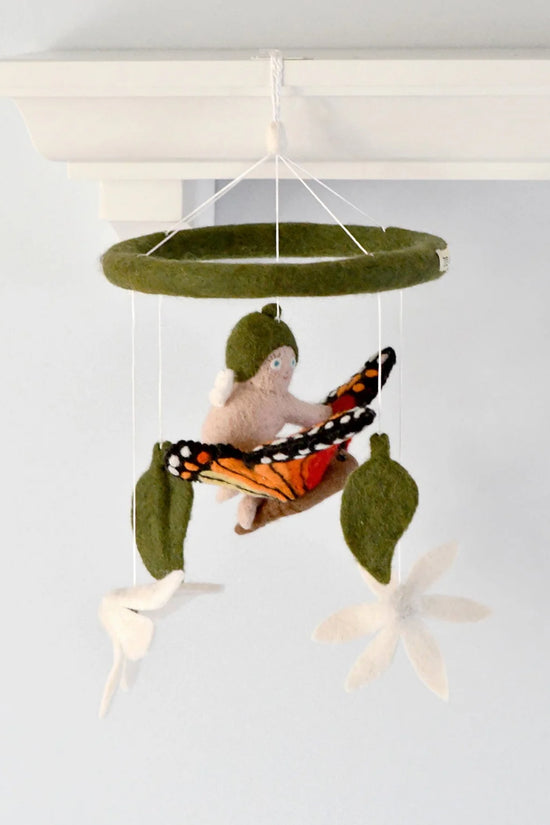 Felt mobile with a child, butterfly, and leaves on a white background